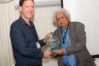 Stuart receiving award