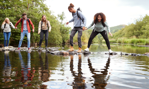 Friends on a walk - Shutterstock