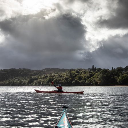 woman kayaking on a loch