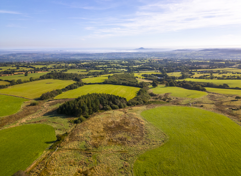 Birdseye view of Betchcott Hill with the Wrekin peaking out of the clouds in the background